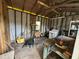 Dilapidated shed interior with unfinished walls, exposed rafters, and old washer at 825 Poinsettia Dr, Eustis, FL 32726