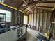 Shed interior featuring exposed framing, a workbench, and minimal storage at 825 Poinsettia Dr, Eustis, FL 32726
