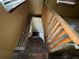 View down a set of stairs to the ground floor at 825 Poinsettia Dr, Eustis, FL 32726