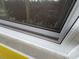 Close-up of a window with a window screen at 825 Poinsettia Dr, Eustis, FL 32726