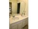 Clean bathroom with double sinks, ample counter space, and a large vanity mirror at 9005 Reflection Pointe Dr, Windermere, FL 34786