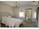 Bright bedroom with large mirror and neutral color scheme, offering a relaxing retreat at 9005 Reflection Pointe Dr, Windermere, FL 34786