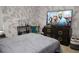Cozy bedroom with dark gray walls and a wall-mounted television at 9005 Reflection Pointe Dr, Windermere, FL 34786