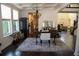 Open dining area with coffered ceilings, hard wood floors, and large windows at 9005 Reflection Pointe Dr, Windermere, FL 34786