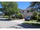 Beautiful two-story home with landscaped front yard, attached garage, and inviting curb appeal at 9005 Reflection Pointe Dr, Windermere, FL 34786