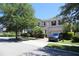 Beautiful two-story home with landscaped front yard, attached garage, and inviting curb appeal at 9005 Reflection Pointe Dr, Windermere, FL 34786