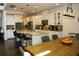 Bright eat-in kitchen with a granite island, pendant lighting, and stainless steel appliances at 9005 Reflection Pointe Dr, Windermere, FL 34786