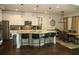 Eat-in kitchen featuring white cabinets, granite countertops, and stainless-steel appliances at 9005 Reflection Pointe Dr, Windermere, FL 34786