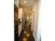 Modern kitchen with stainless steel appliances, white cabinetry, and wood floors throughout at 9005 Reflection Pointe Dr, Windermere, FL 34786