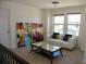 Bright living area featuring neutral colors, natural light, and comfortable seating arrangements at 9005 Reflection Pointe Dr, Windermere, FL 34786