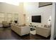 Bright and airy living room with high ceilings, modern furniture, and dark wood floors at 9005 Reflection Pointe Dr, Windermere, FL 34786