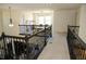 Spacious upper loft featuring decorative railing and open area for additional living space at 9005 Reflection Pointe Dr, Windermere, FL 34786