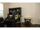 Well-lit office features dark wooden desk, shelves, and sleek, transparent chair at 9005 Reflection Pointe Dr, Windermere, FL 34786