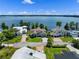 Aerial view showcasing waterfront homes with lush landscaping and access to a serene lake at 9916 Lone Tree Ln, Orlando, FL 32836