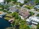 Stunning aerial shot featuring waterfront homes, lush landscapes, and private docks at 9916 Lone Tree Ln, Orlando, FL 32836