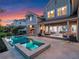 Twilight shot showcasing the pool, spa, patio, and outdoor kitchen; perfect for evening gatherings at 9916 Lone Tree Ln, Orlando, FL 32836