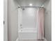 Bathroom featuring a white tub and shower combination with subway tile surround and a shower curtain at 9916 Lone Tree Ln, Orlando, FL 32836