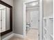 Bathroom doorway with a linen cabinet and a view to the commode and vanity at 9916 Lone Tree Ln, Orlando, FL 32836