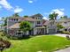 Beautifully landscaped home with a spacious front yard, mature trees, and a classic design at 9916 Lone Tree Ln, Orlando, FL 32836