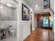 Wide hallway featuring access to the staircase, half bath, butler's pantry and wine cellar at 9916 Lone Tree Ln, Orlando, FL 32836