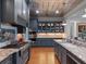 Modern kitchen with granite countertops, stainless steel appliances, and stylish cabinetry, perfect for culinary enthusiasts at 9916 Lone Tree Ln, Orlando, FL 32836