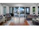 Elegant living room with a waterfront view and access to the outdoor gazebo and pool at 9916 Lone Tree Ln, Orlando, FL 32836