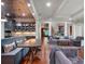 Open living space seamlessly connecting the kitchen, dining, and lounge areas with modern finishes at 9916 Lone Tree Ln, Orlando, FL 32836