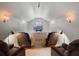 Media room featuring recliner seating, sconce lighting, and a television at 9916 Lone Tree Ln, Orlando, FL 32836