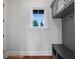 Well-organized mudroom with custom cabinetry and a window offering natural light and scenic views at 9916 Lone Tree Ln, Orlando, FL 32836