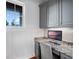 Cozy office space featuring granite countertops, built-in cabinets, and a window overlooking the outdoors at 9916 Lone Tree Ln, Orlando, FL 32836