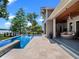 Relaxing pool area with cozy seating and scenic lake views, perfect for outdoor living at 9916 Lone Tree Ln, Orlando, FL 32836