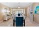 Open dining room features stylish decor, artwork, and a sophisticated chandelier at 10371 Kensington Shore Dr # H-201, Orlando, FL 32827