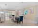Open dining room features stylish decor, artwork, and a sophisticated chandelier at 10371 Kensington Shore Dr # H-201, Orlando, FL 32827