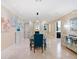 Open dining room features stylish decor, artwork, and a sophisticated chandelier at 10371 Kensington Shore Dr # H-201, Orlando, FL 32827