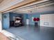 Spacious garage with storage cabinets, golf cart, and ample room for parking or projects at 10371 Kensington Shore Dr # H-201, Orlando, FL 32827