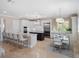 Bright kitchen featuring stainless steel appliances, marble countertops, and an island with bar seating at 10371 Kensington Shore Dr # H-201, Orlando, FL 32827