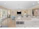 Spacious open-concept featuring stainless steel appliances, a stylish island, and marble countertops at 10371 Kensington Shore Dr # H-201, Orlando, FL 32827