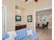 Cozy living room featuring modern furniture, neutral paint, and view into dining room at 10371 Kensington Shore Dr # H-201, Orlando, FL 32827