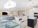 Open concept living space with adjacent dining area and a bright living room at 10371 Kensington Shore Dr # H-201, Orlando, FL 32827