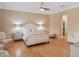 Serene main bedroom with light wood floors offers a comfortable and inviting retreat at 10371 Kensington Shore Dr # H-201, Orlando, FL 32827