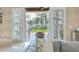 Comfortable covered patio offers a relaxing outdoor living space with scenic views of lush landscaping at 10371 Kensington Shore Dr # H-201, Orlando, FL 32827