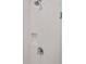 Bright shower featuring white tiles, built-in niche and chrome showerhead and handle at 10371 Kensington Shore Dr # H-201, Orlando, FL 32827