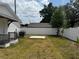 Large, private backyard features a newly built white fence and level ground at 1040 20Th St, Orlando, FL 32805