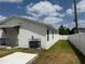 Exterior of home, view of backyard with white privacy fence, well maintained lawn at 1040 20Th St, Orlando, FL 32805