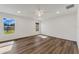 Spacious bedroom features wood-look flooring, natural light, and a modern ceiling fan at 1040 20Th St, Orlando, FL 32805