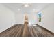 Bright bedroom with wood-look flooring leading into ensuite bath at 1040 20Th St, Orlando, FL 32805