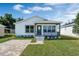 Charming one-story home with a welcoming front porch and well-manicured lawn at 1040 20Th St, Orlando, FL 32805