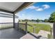 Covered front porch with a view of the community pond at 1040 20Th St, Orlando, FL 32805