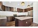 Kitchen featuring stainless steel appliances, dark cabinets, and a breakfast bar at 1040 20Th St, Orlando, FL 32805