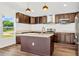 Kitchen with dark cabinets, stainless steel appliances, and a center island at 1040 20Th St, Orlando, FL 32805